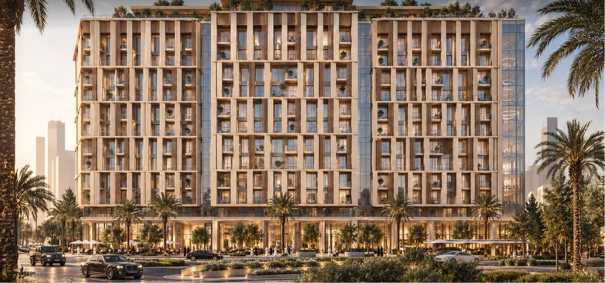 LASAL at dusk, its lit stone fins rising above the landscaped forecourt