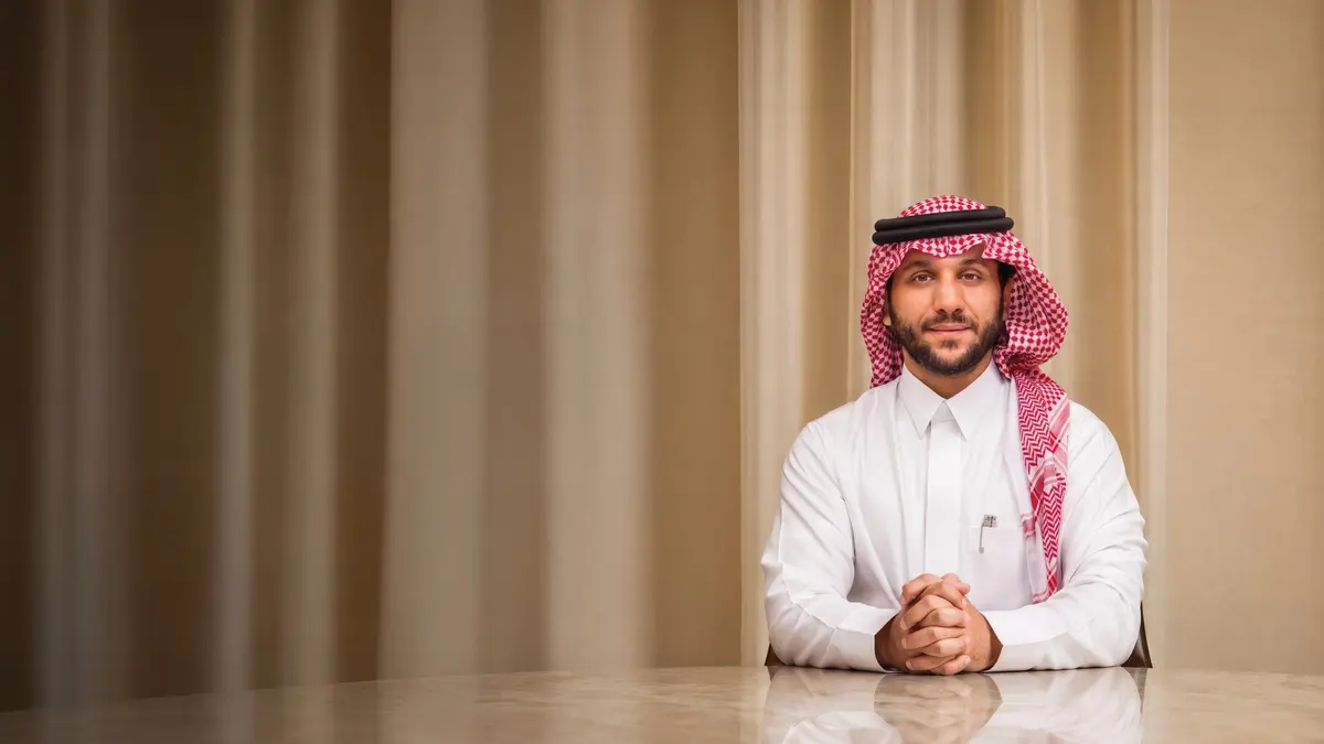 Salman Khaled Assiri, Chief Executive Officer of SKALE, seated at a table